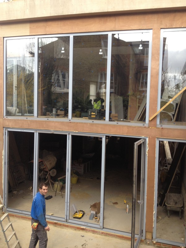 Aluminium bi-fold doors with two-storey glazing in Walthamstow