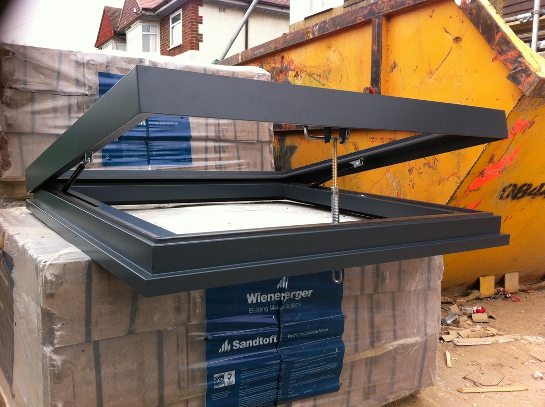 Opening flat roof skylight in anthracite grey installed in Walthamstow